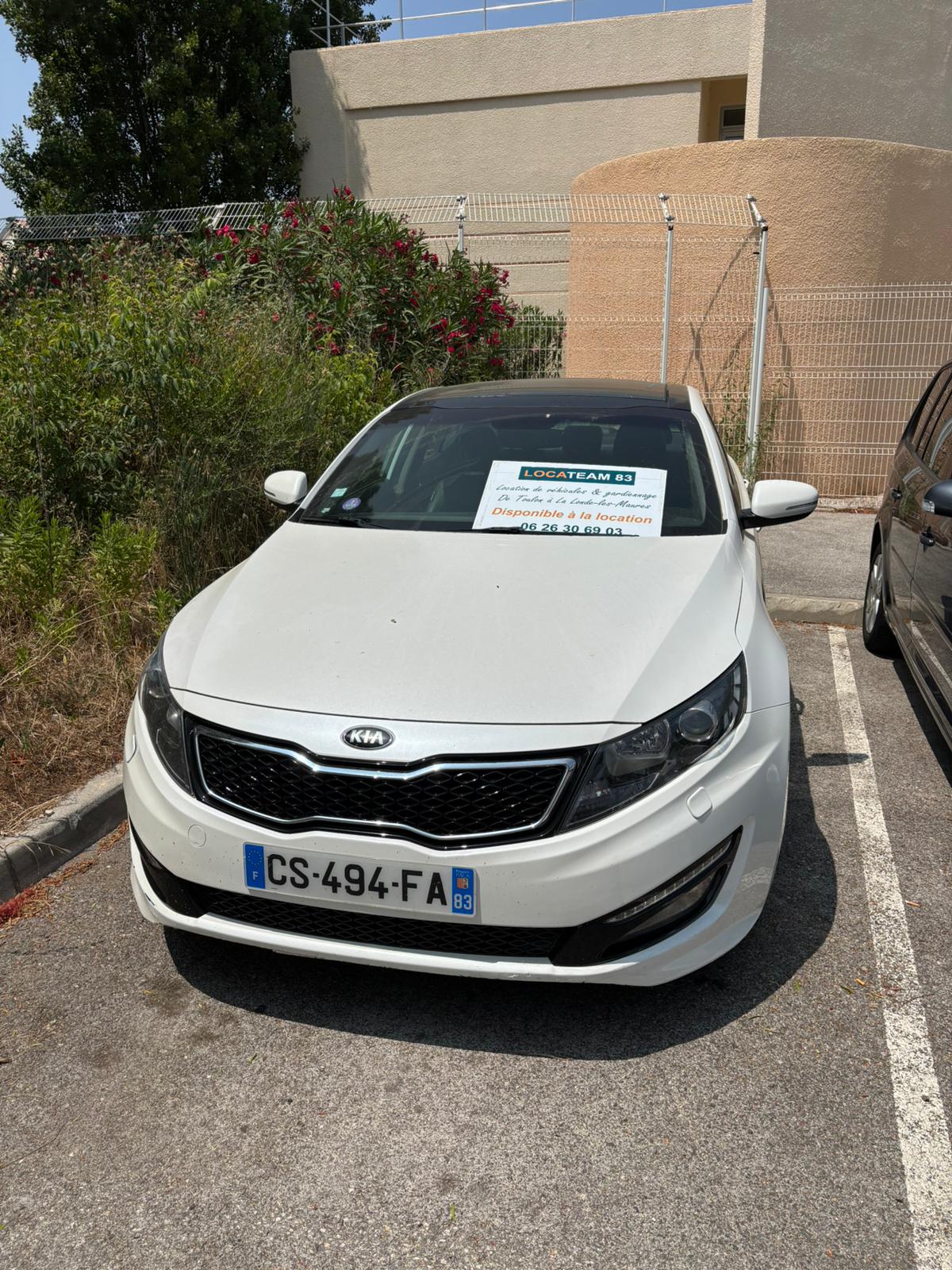 Kia optima blanche à louer